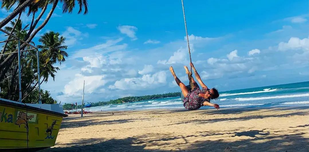 A traveler swing at Uppuveli Beach in Trincomalee, Sri Lanka