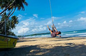 A traveler swing at Uppuveli Beach in Trincomalee, Sri Lanka